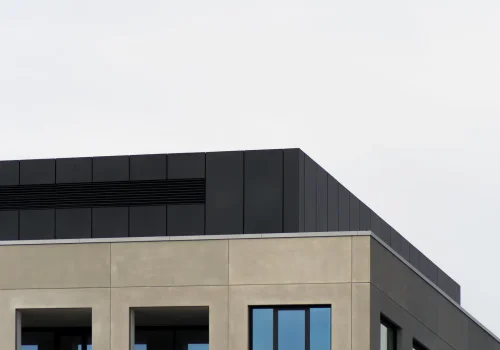 concrete-building-with-mirror-windows-clear-sky